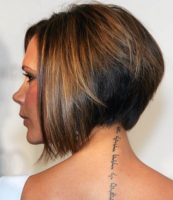 side tattoos of quotes. victoria beckham tattoo on